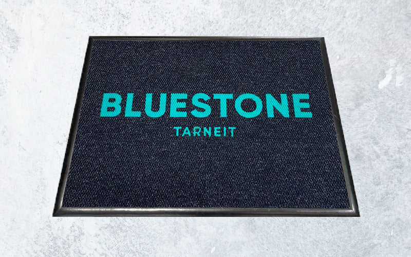 Blue and denim inlay custom logo mat for a restaurant.