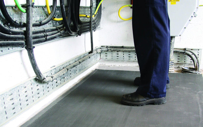 Insitu image of the Corrugated Switch Board Matting used by an electrician near a control room