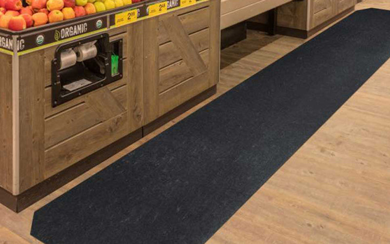 Insitu product image of black, non-slip SmartGrip Matting in fresh produce area of supermarket.