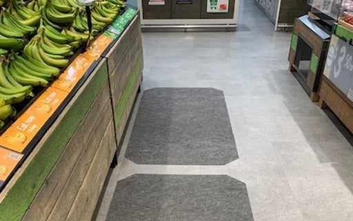 Insitu product image of grey, non-slip SmartGrip Matting in fresh produce area of supermarket.