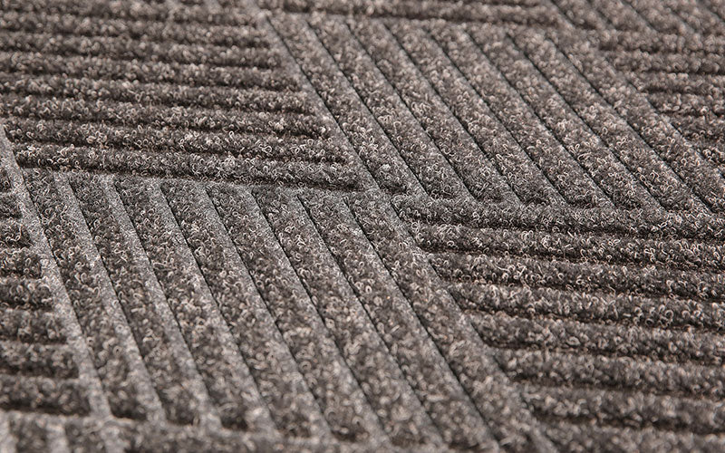 Close up product image of charcoal, polypropylene Waterhog Eco Premier Mat made for commercial and residential entrances