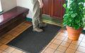 Insitu image of a rubber edged waterhog mat perfect for hospitality entryways.